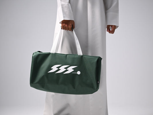 A dark green duffel bag with white handles and a white stylized SSS.